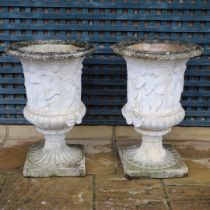 A PAIR OF PAINTED COMPOSITE MARBLE MEDICI STYLE URNS.