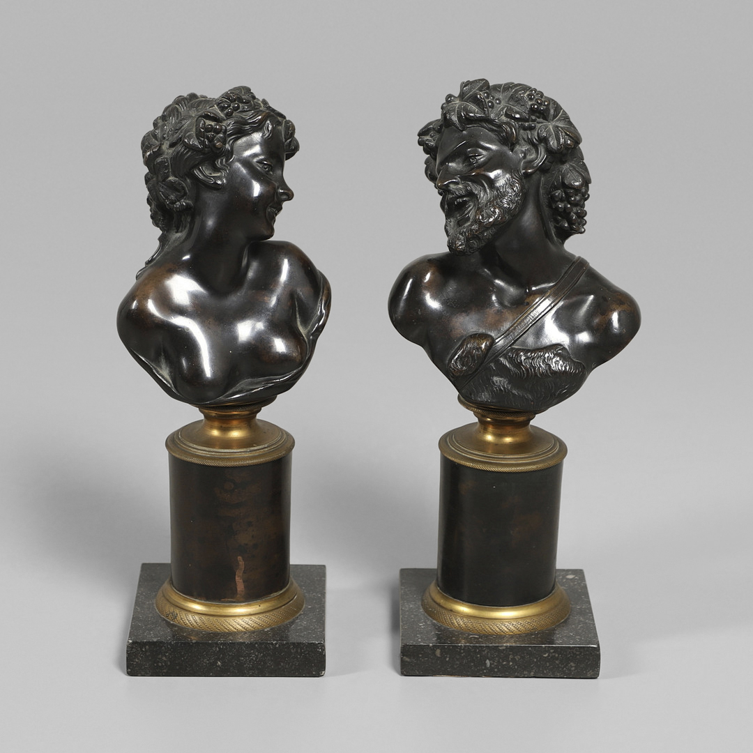 AFTER CLAUDE MICHEL CLODION (FRENCH, 1738 - 1814), A PAIR OF BRONZE BUSTS OF BACCHUS AND BACCANTE.