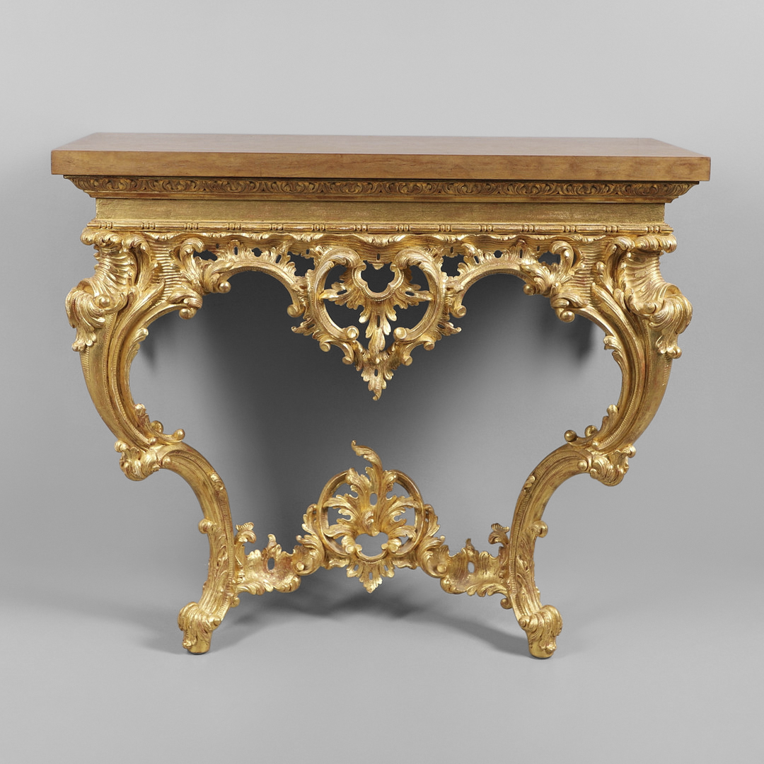 A LOUIS XVI STYLE GILTWOOD CONSOLE TABLE.