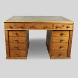 A LATE 19TH CENTURY OAK PARTNERS DESK.