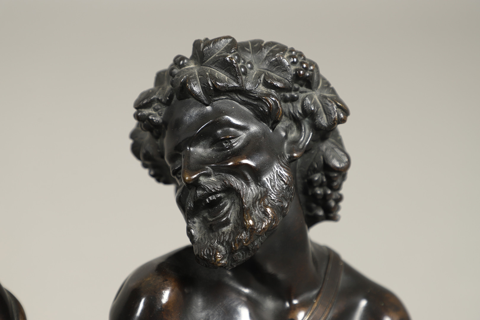AFTER CLAUDE MICHEL CLODION (FRENCH, 1738 - 1814), A PAIR OF BRONZE BUSTS OF BACCHUS AND BACCANTE. - Image 4 of 10