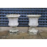 A PAIR OF FRENCH PAINTED BUFF TERRACOTTA URNS.