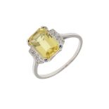 A YELLOW SAPPHIRE AND DIAMOND RING.