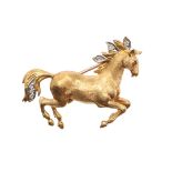 AN 18CT GOLD AND DIAMOND GALLOPING HORSE BROOCH.