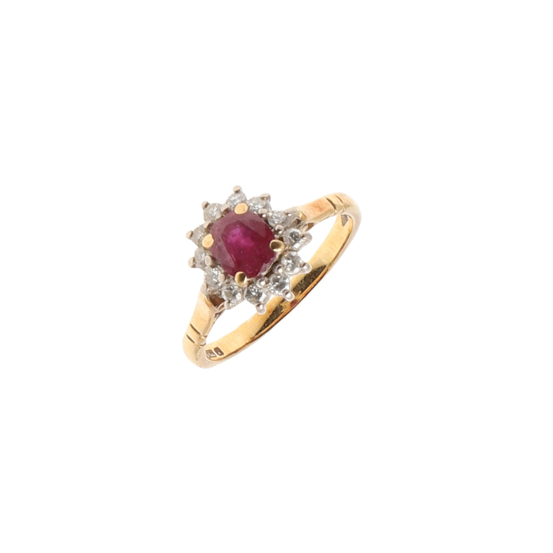 A RUBY AND DIAMOND CLUSTER RING.