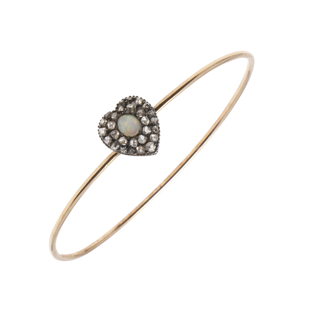 A DIAMOND, OPAL AND GOLD BANGLE.