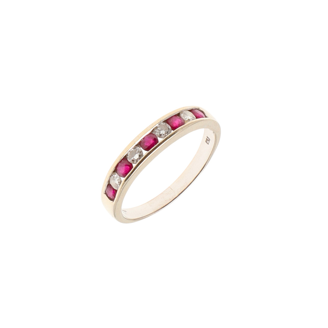 A RUBY AND DIAMOND HALF HOOP RING.
