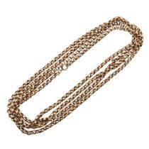 A 9CT GOLD LONG GUARD CHAIN.