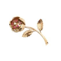 A GOLD, RUBY AND CULTURED PEARL FOLIATE SPRAY BROOCH.