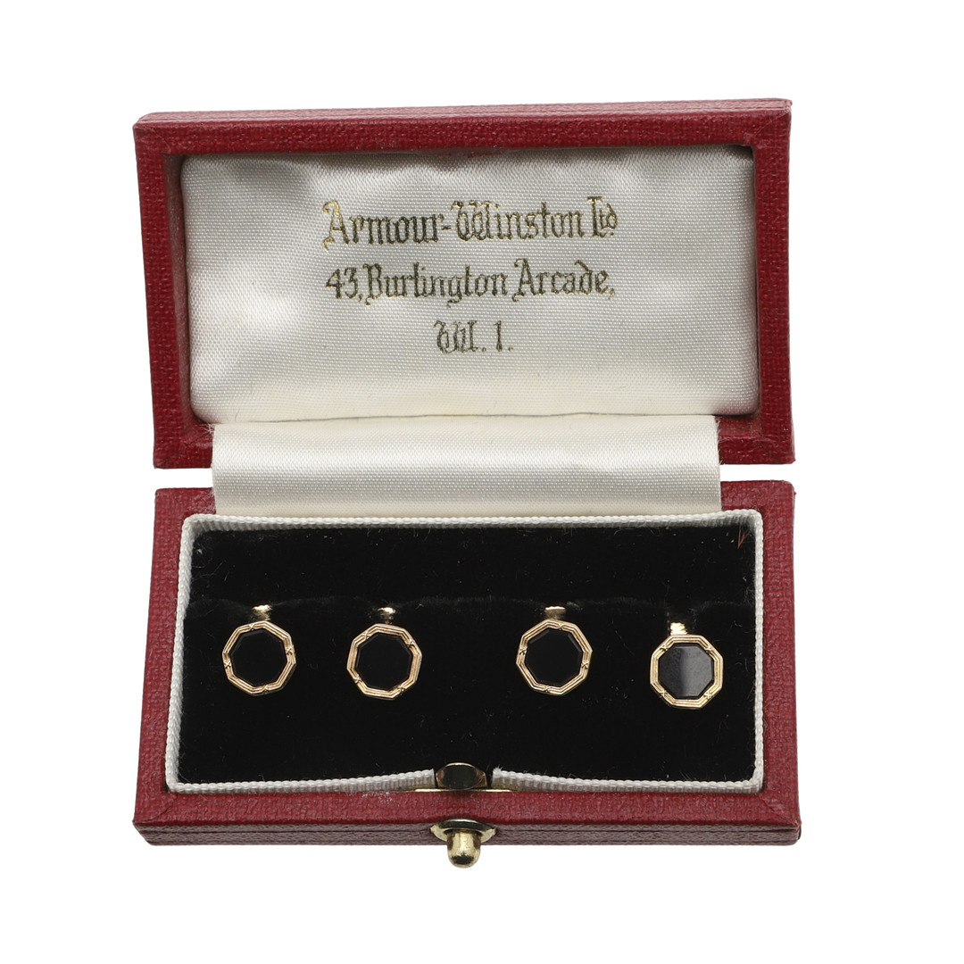 A SET OF FOUR BLACK ONYX AND 9CT GOLD DRESS STUDS BY CROP & FARR.