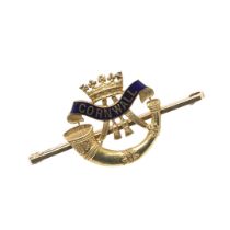 A 15CT GOLD AND ENAMEL REGIMENTAL BROOCH FOR THE DUKE OF CORNWALL'S LIGHT INFANTRY BY CHARLES PACKER