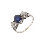 A SAPPHIRE AND DIAMOND THREE STONE RING.