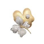 A DIAMOND AND TWO COLOUR GOLD FOLIATE BROOCH.