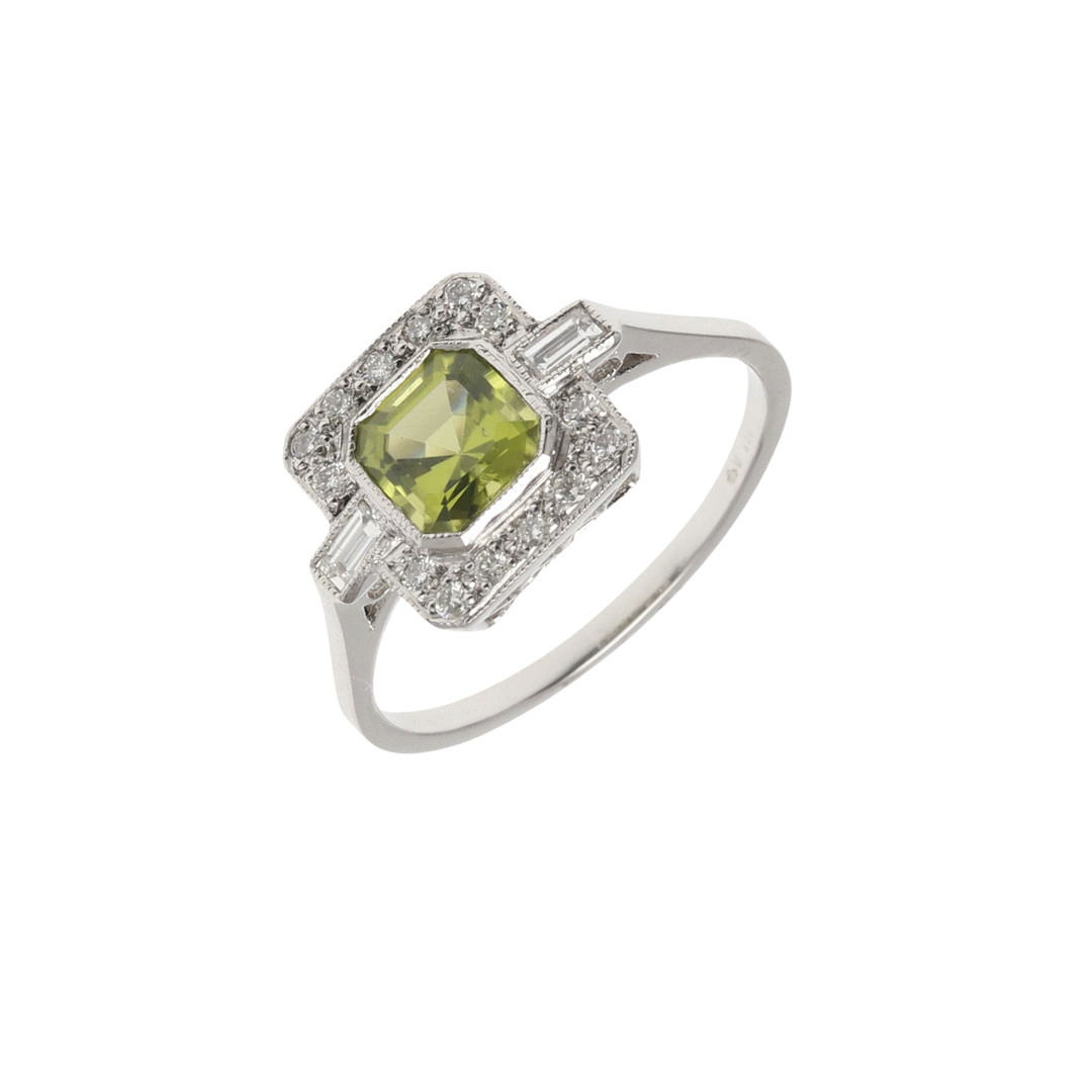 A PERIDOT AND DIAMOND CLUSTER RING.
