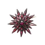 A GEORGIAN GARNET STARBURST BROOCH.