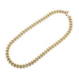 AN 18CT GOLD FANCY LINK NECKLACE.