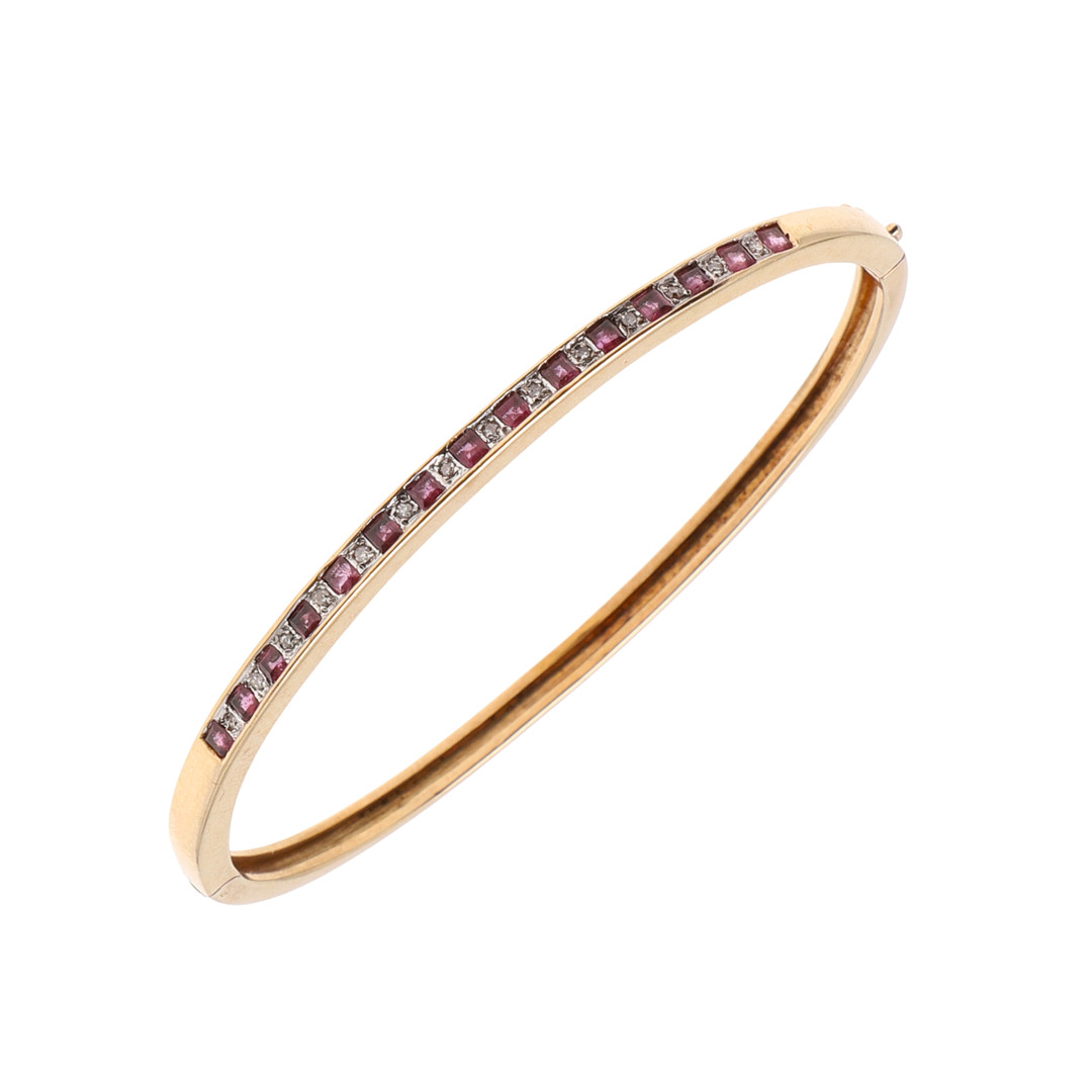 A RUBY AND DIAMOND HALF HINGED BANGLE.