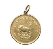 A GOLD KRUGERRAND.