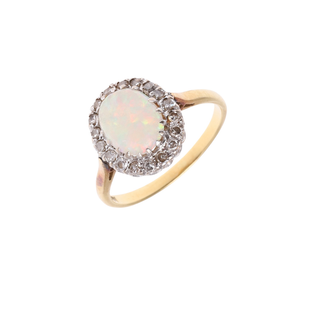 AN OPAL & DIAMOND CLUSTER RING.