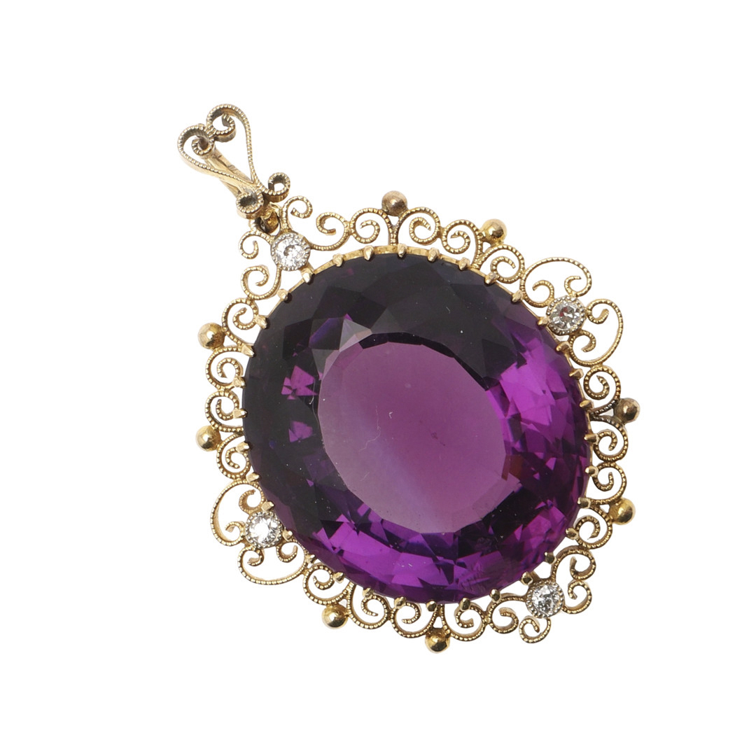 AN AMETHYST AND DIAMOND PENDANT.