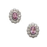A PAIR OF PINK SAPPHIRE AND DIAMOND STUD EARRINGS.