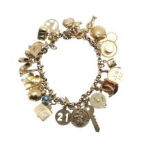 A GOLD CHARM BRACELET.