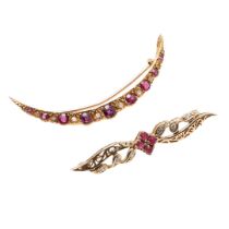 A DIAMOND AND RUBY OPEN CRESCENT BROOCH.