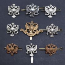 AN INTERESTING COLLECTION OF 1ST KING'S DRAGOON GUARDS CAP AND COLLAR BADGES.