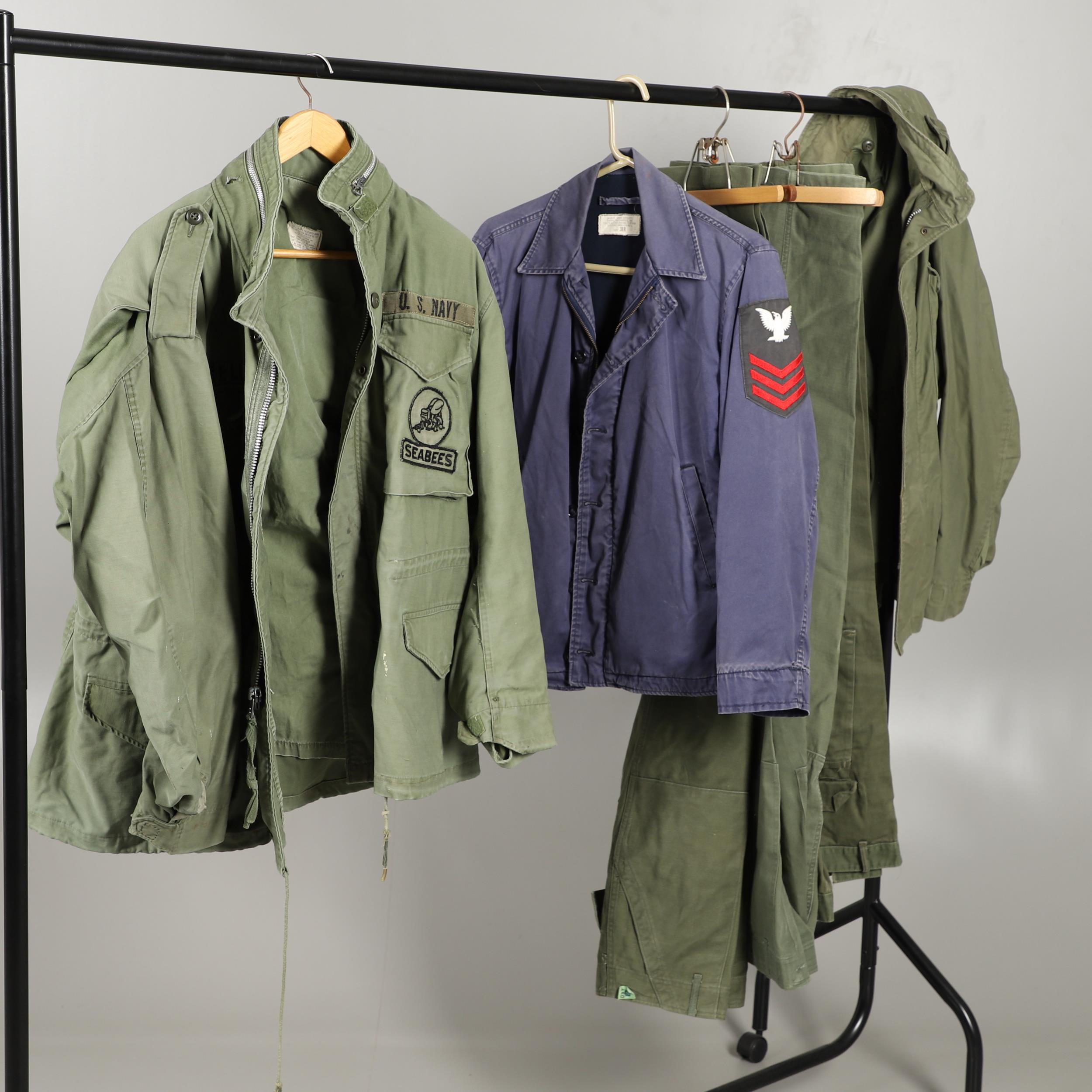 AN AMERICAN ARMY M65 FIELD COAT AND OTHERS.