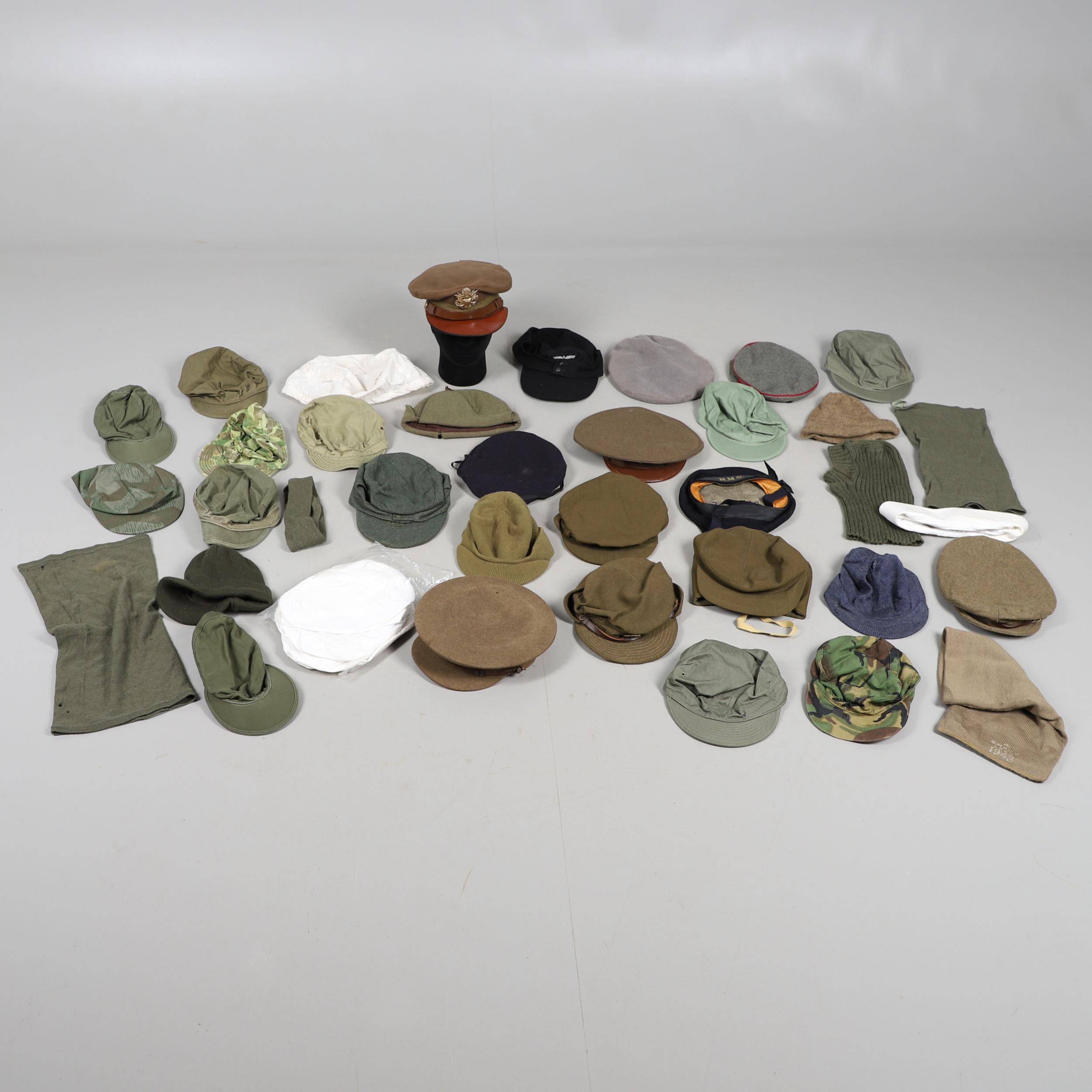 AN EXTENSIVE COLLECTION OF MILITARY UNIFORM CAPS, BERETS AND OTHER ITEMS. SECOND WORLD WAR AND LATER