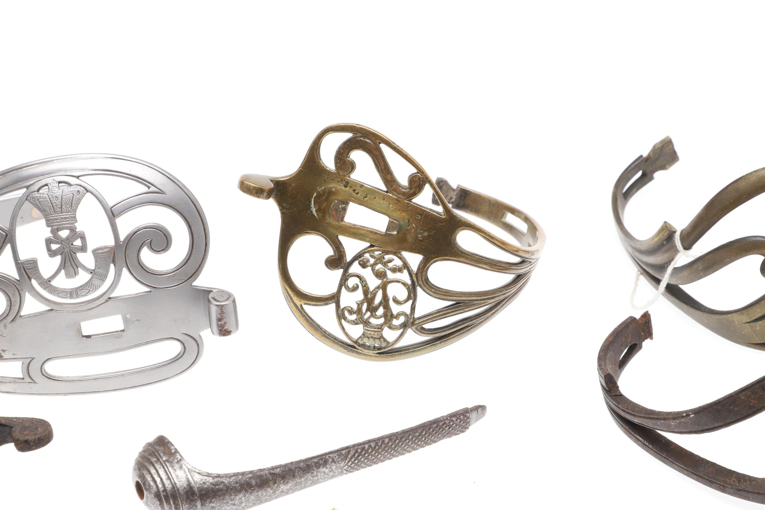 A COLLECTION OF SWORD FITTINGS TO INCLUDE GRIPS, GUARDS AND OTHERS. - Image 3 of 12