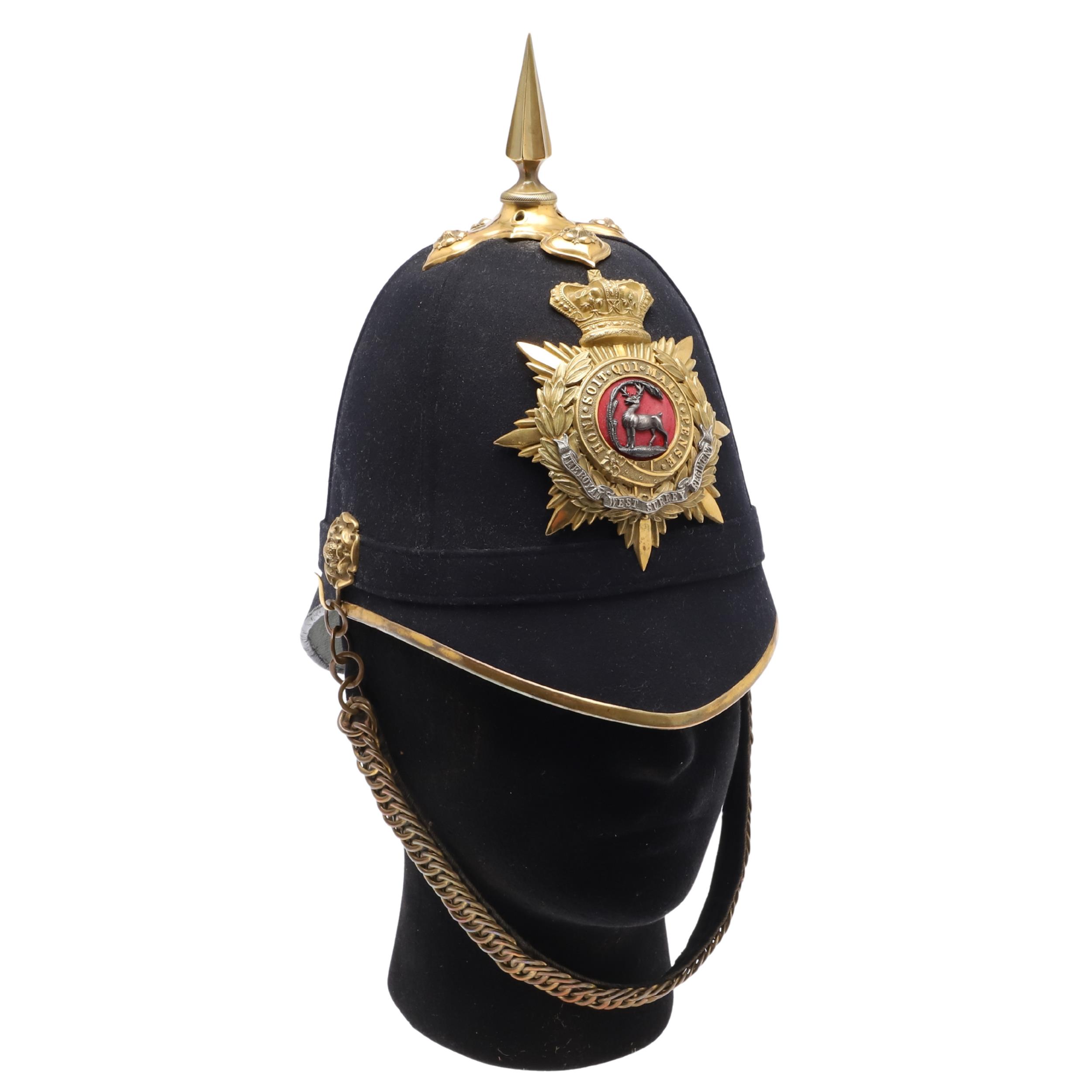 A ROYAL WEST SURREY REGIMENT OFFICER'S BLUE CLOTH HOME SERVICE HELMET.