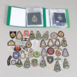 A LARGE COLLECTION OF MILITARY BADGES, MANY BLAZER BADGES AND OTHERS.