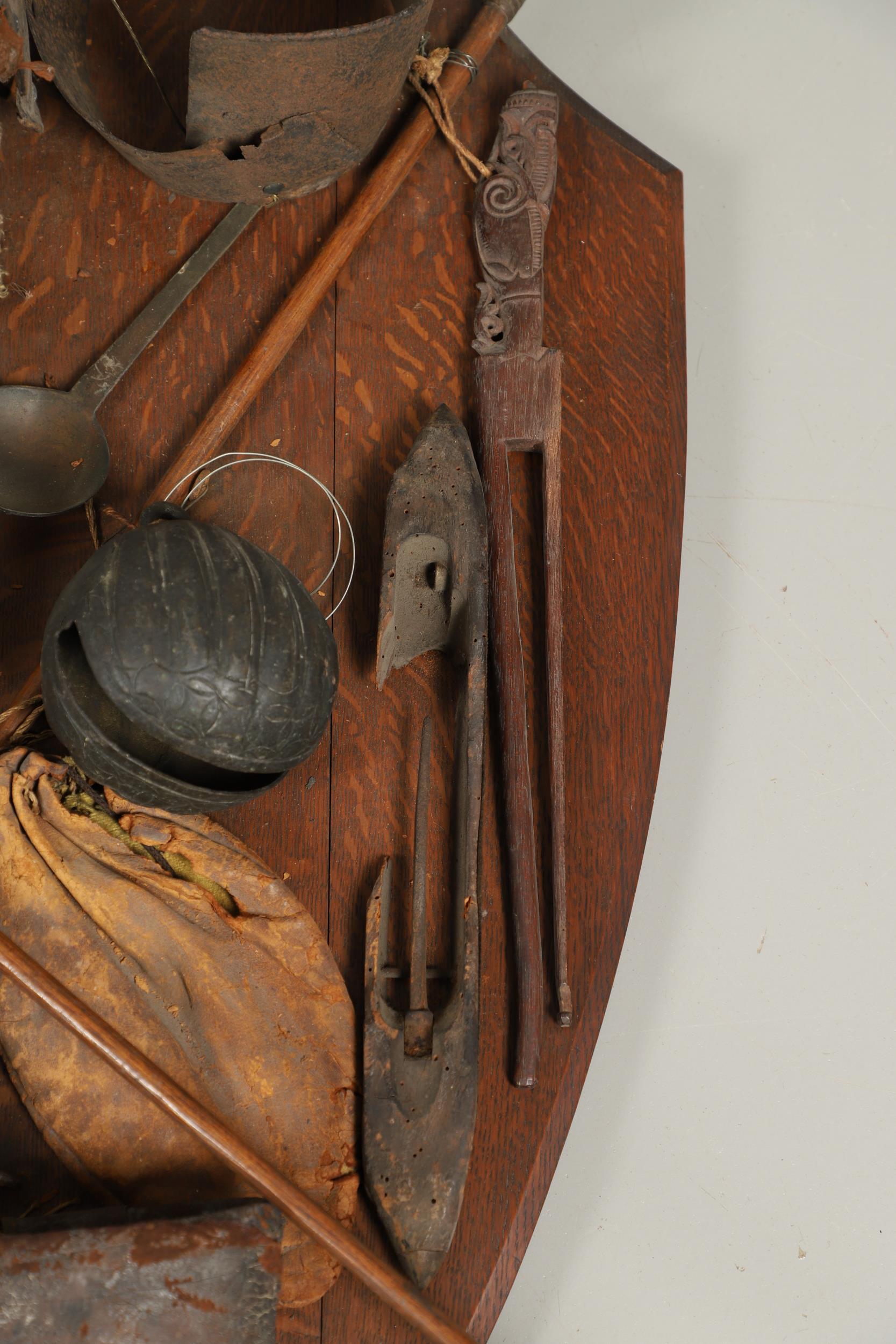 AN UNUSUAL OAK SHIELD MOUNTED WITH MILITARY TROPHIES, CURIOSITIES AND OTHER ITEMS. - Image 11 of 15
