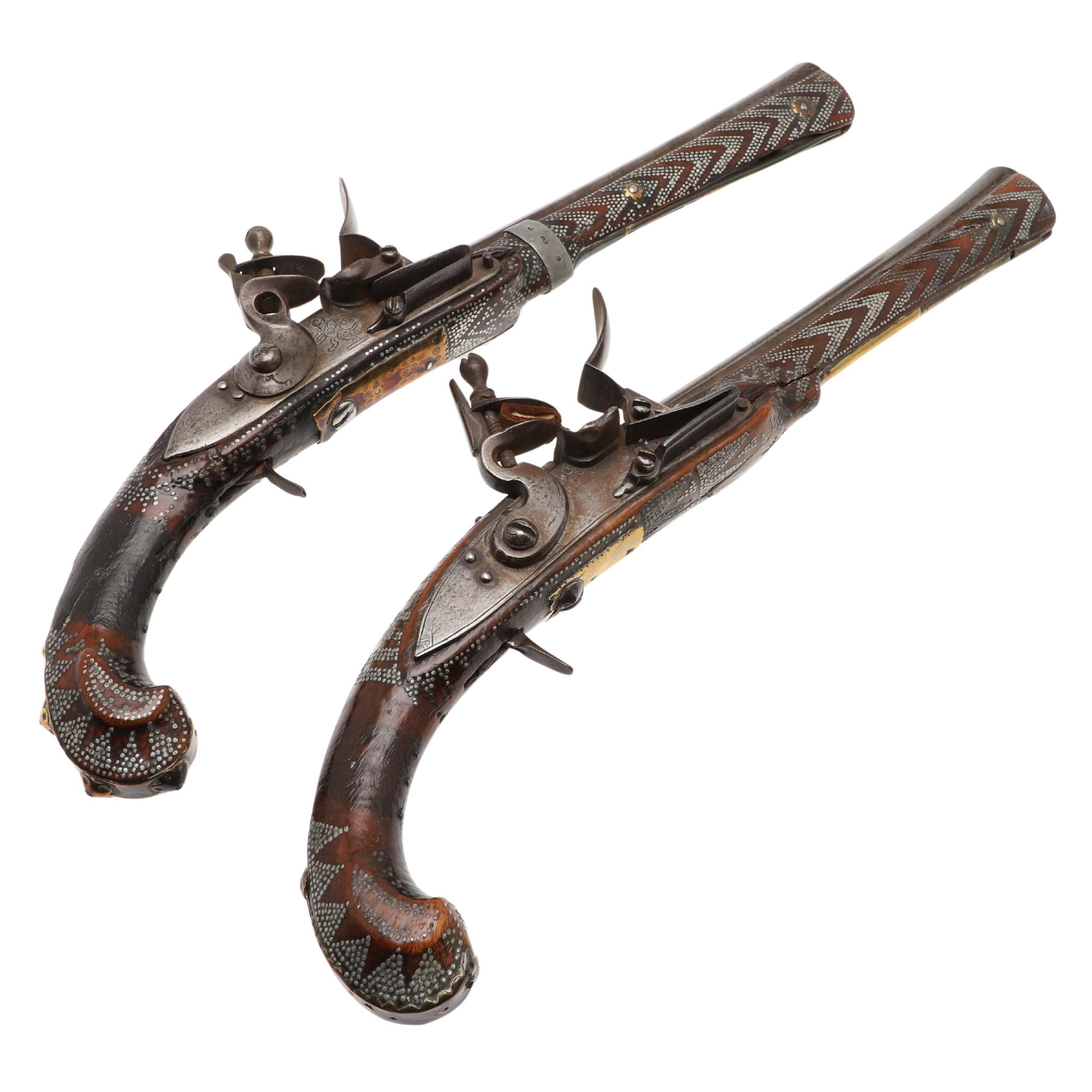 A PAIR OF DECORATED TURKISH FLINTLOCK PISTOLS.