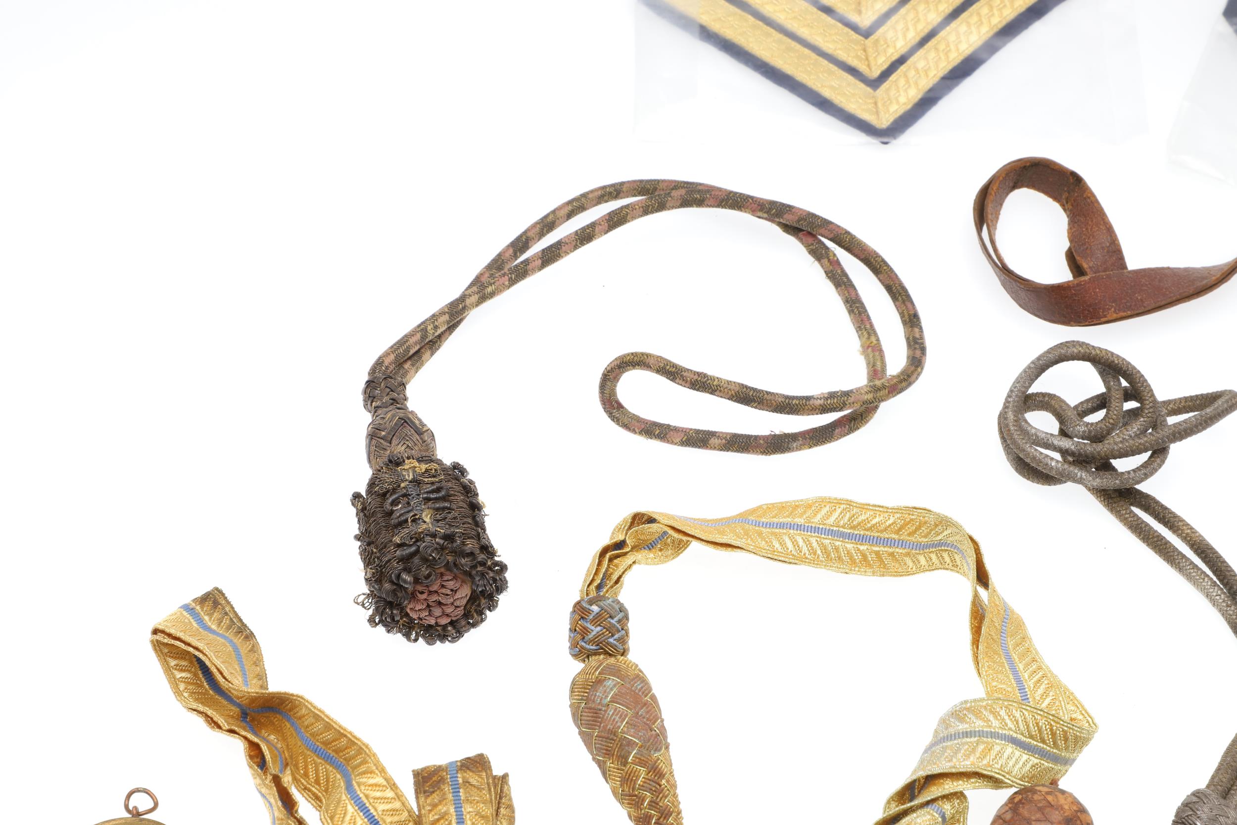 A COLLECTION OF SWORD KNOTS AND MILITARY BADGES. - Image 3 of 11