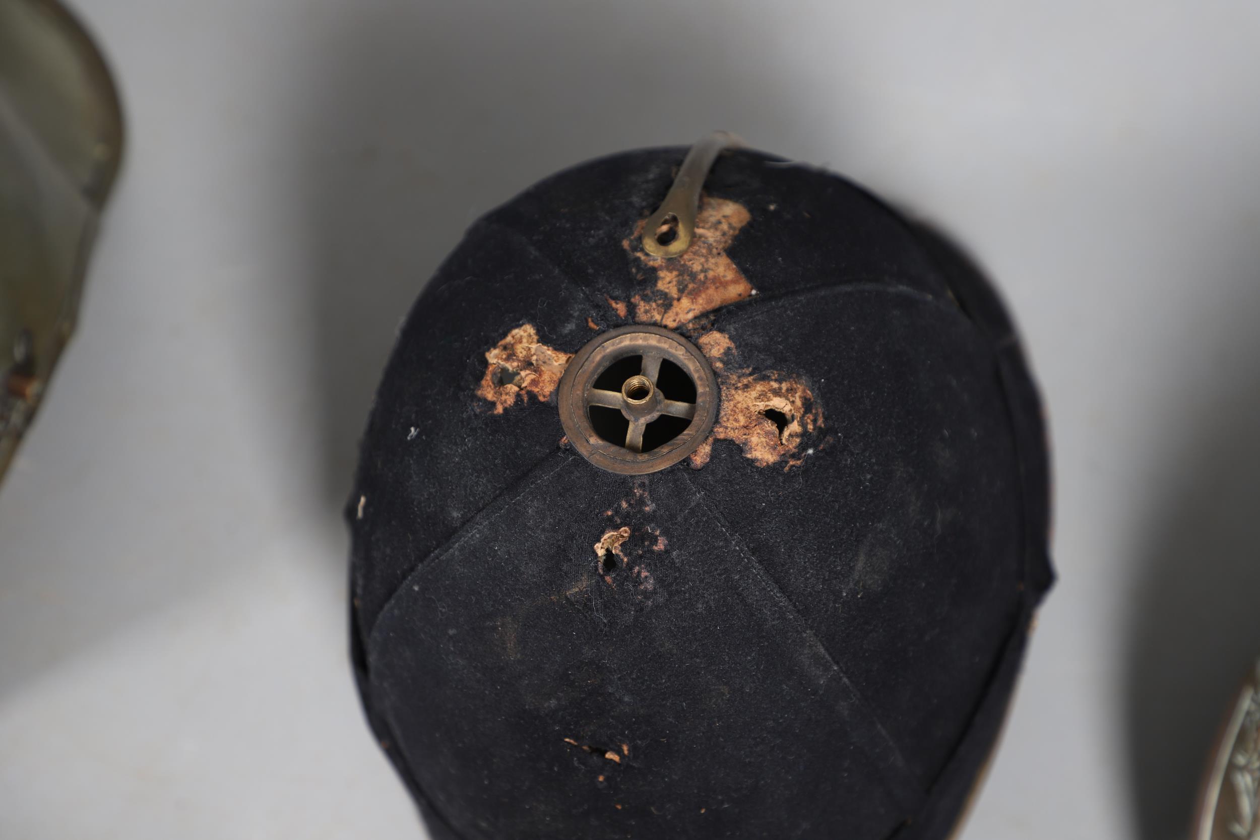 A COLLECTION OF VICTORIAN AND LATER HELMETS AND PARTS TO INCLUDE 1871 PATTERN SHELLS. - Image 15 of 19