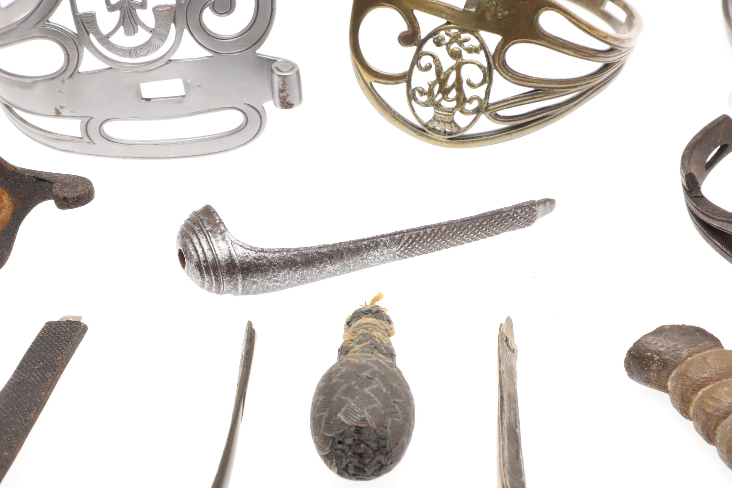 A COLLECTION OF SWORD FITTINGS TO INCLUDE GRIPS, GUARDS AND OTHERS. - Image 11 of 12