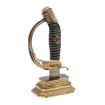 A SWORD HILT DESK ORNAMENT FORMED FROM A PRUSSIAN INFANTRY OFFICER'S 1889 PATTERN SWORD.