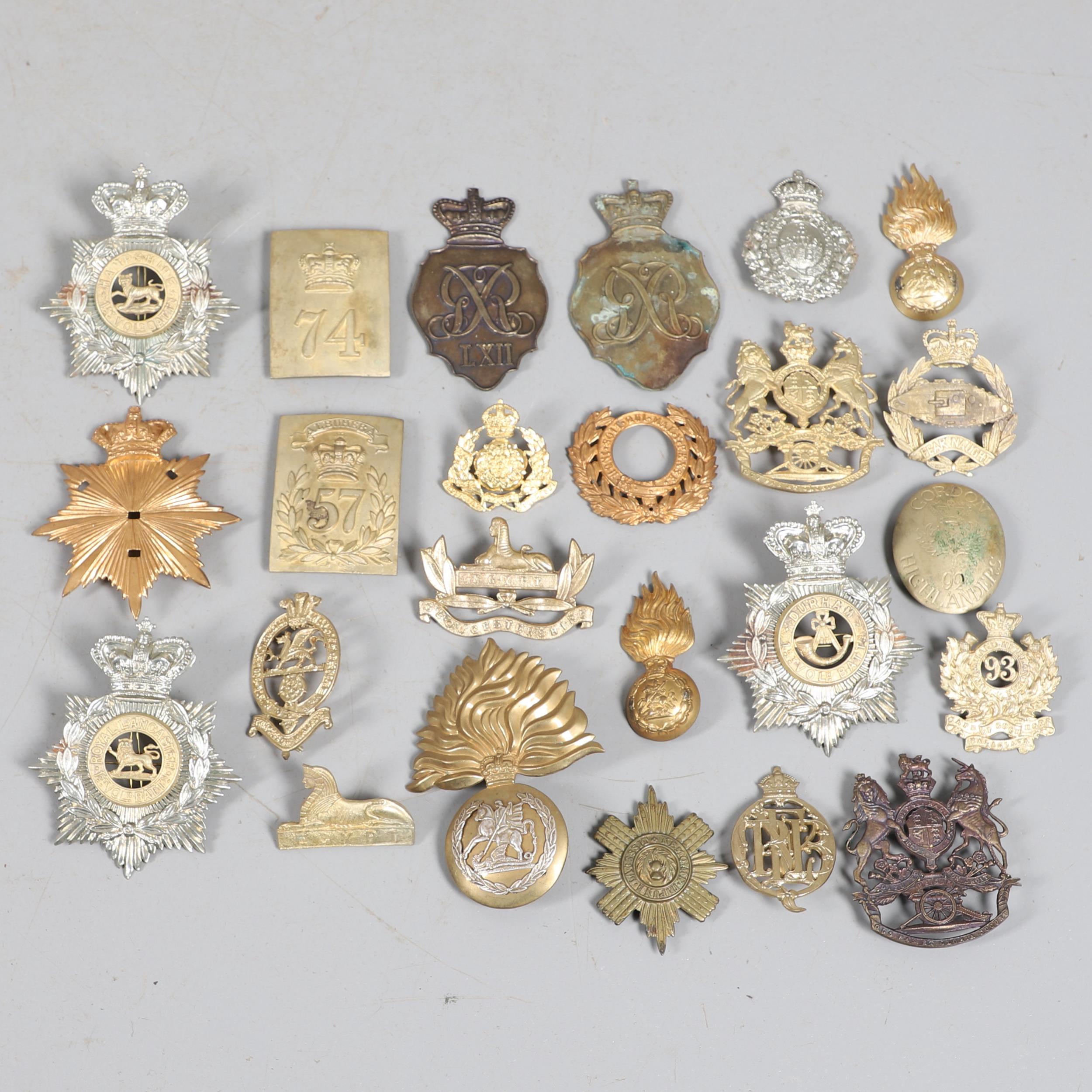 A COLLECTION OF VICTORIAN STYLE HELMET PLATES AND OTHER BADGES.