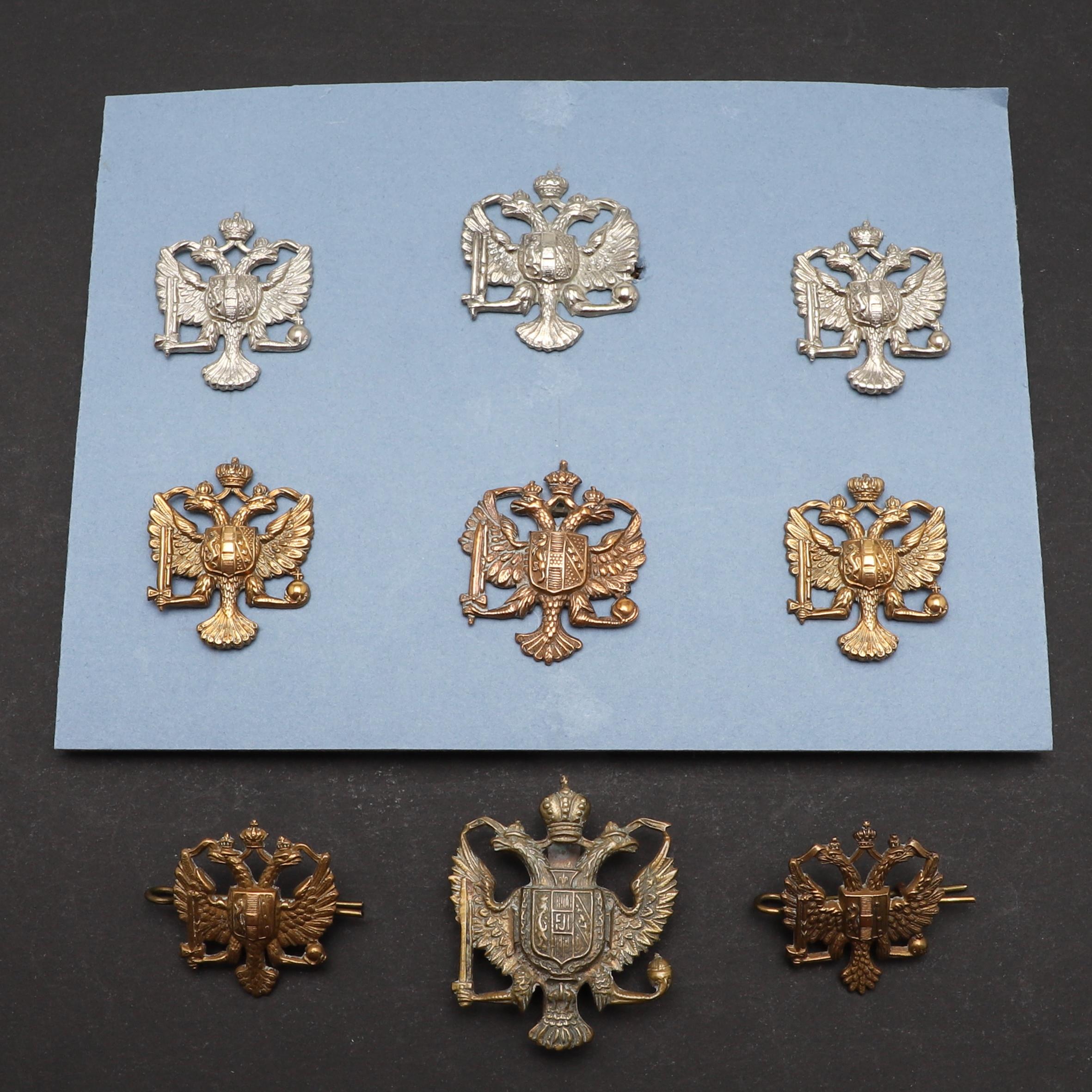 AN INTERESTING COLLECTION OF 1ST KING'S DRAGOON GUARDS CAP AND COLLAR BADGES.