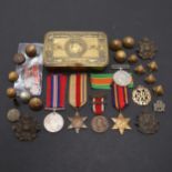 A 1914 CHRISTMAS TIN, SECOND WORLD WAR MEDALS AND A SMALL COLLECTION OF BADGES AND BUTTONS.