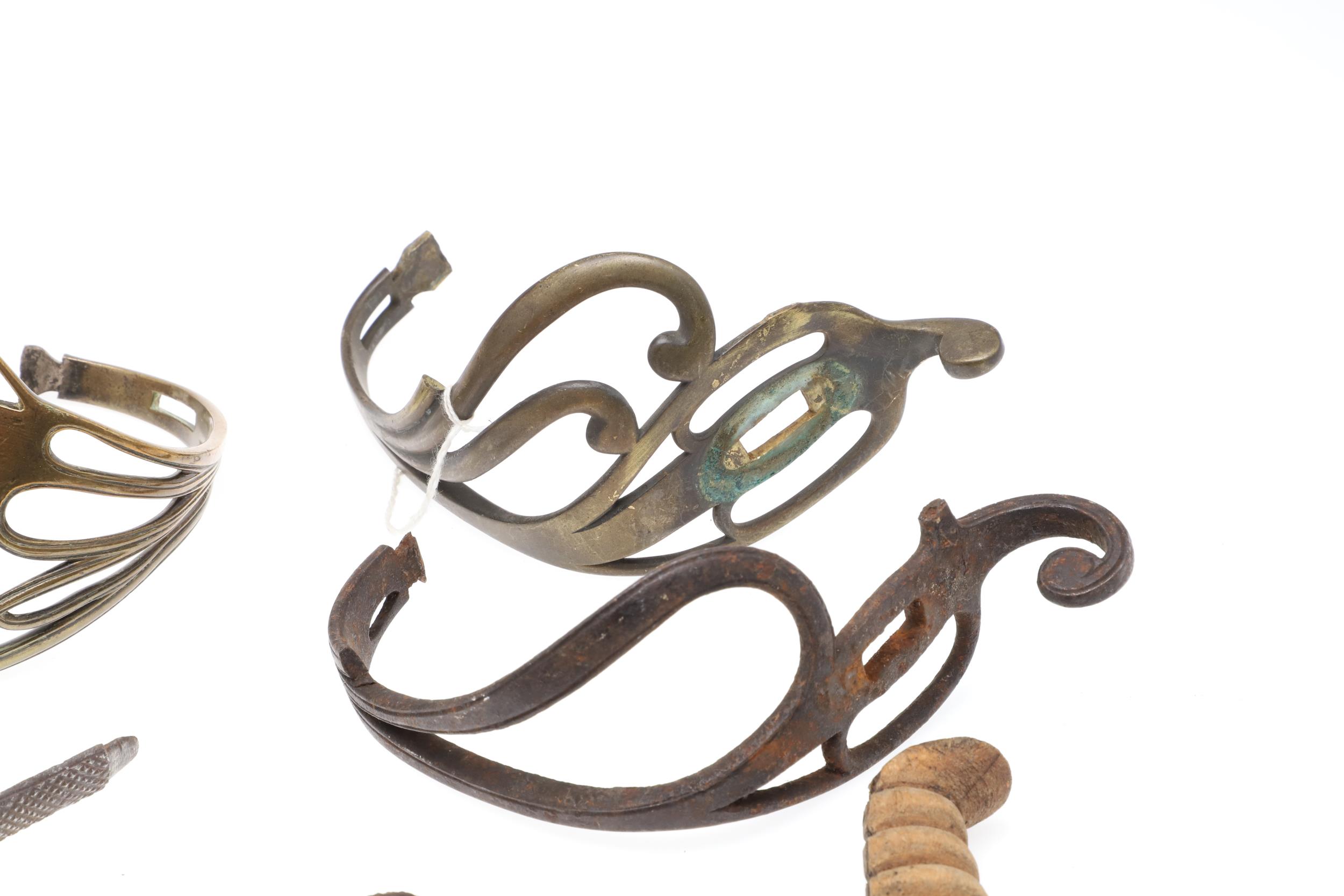 A COLLECTION OF SWORD FITTINGS TO INCLUDE GRIPS, GUARDS AND OTHERS. - Image 5 of 12