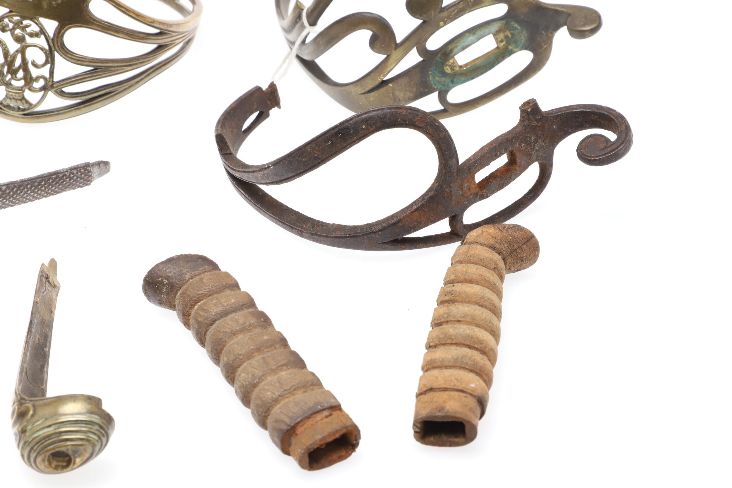 A COLLECTION OF SWORD FITTINGS TO INCLUDE GRIPS, GUARDS AND OTHERS. - Image 8 of 12
