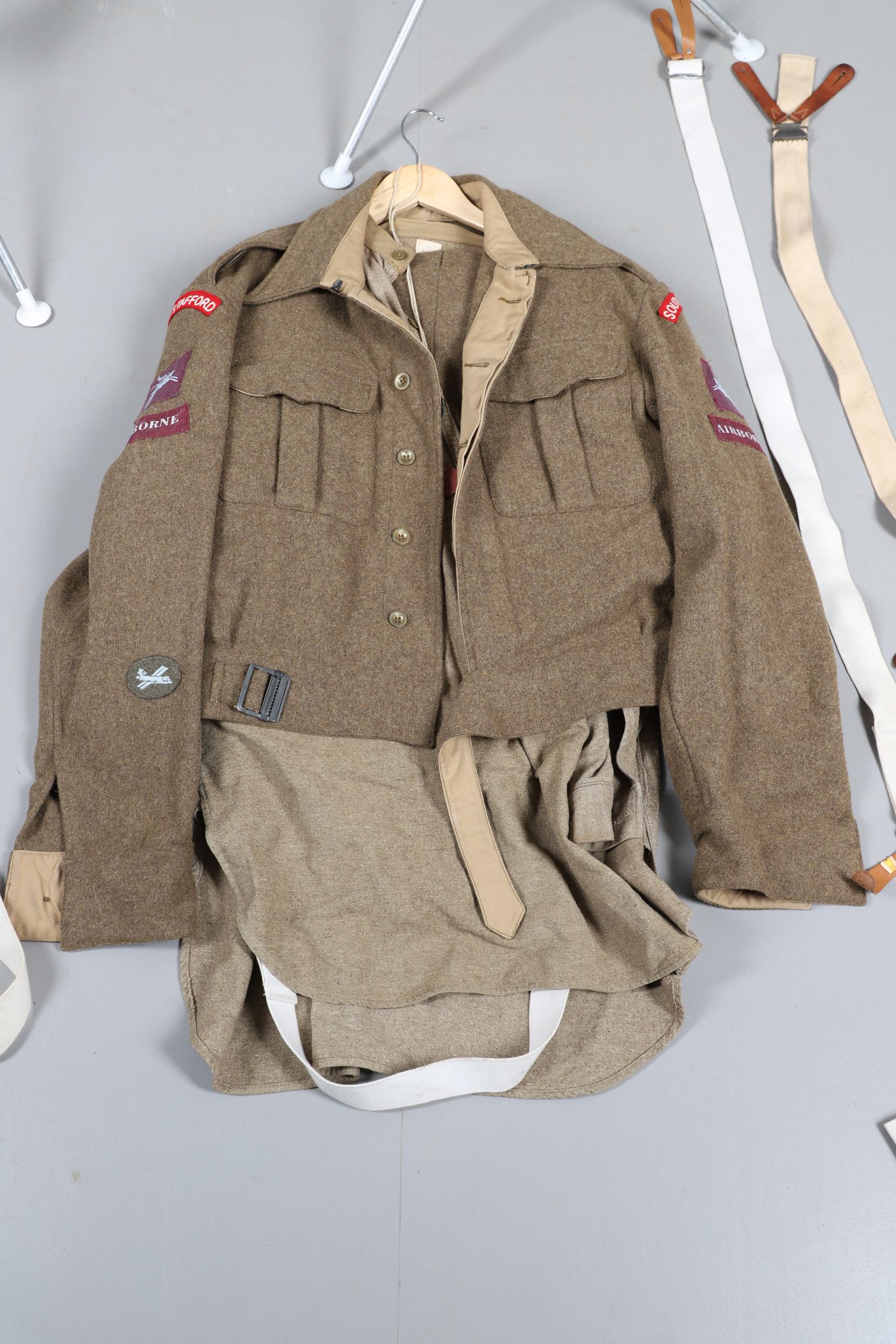A COLLECTION OF SECOND WORLD STYLE BATTLE TUNICS AND TROUSERS. - Image 9 of 24
