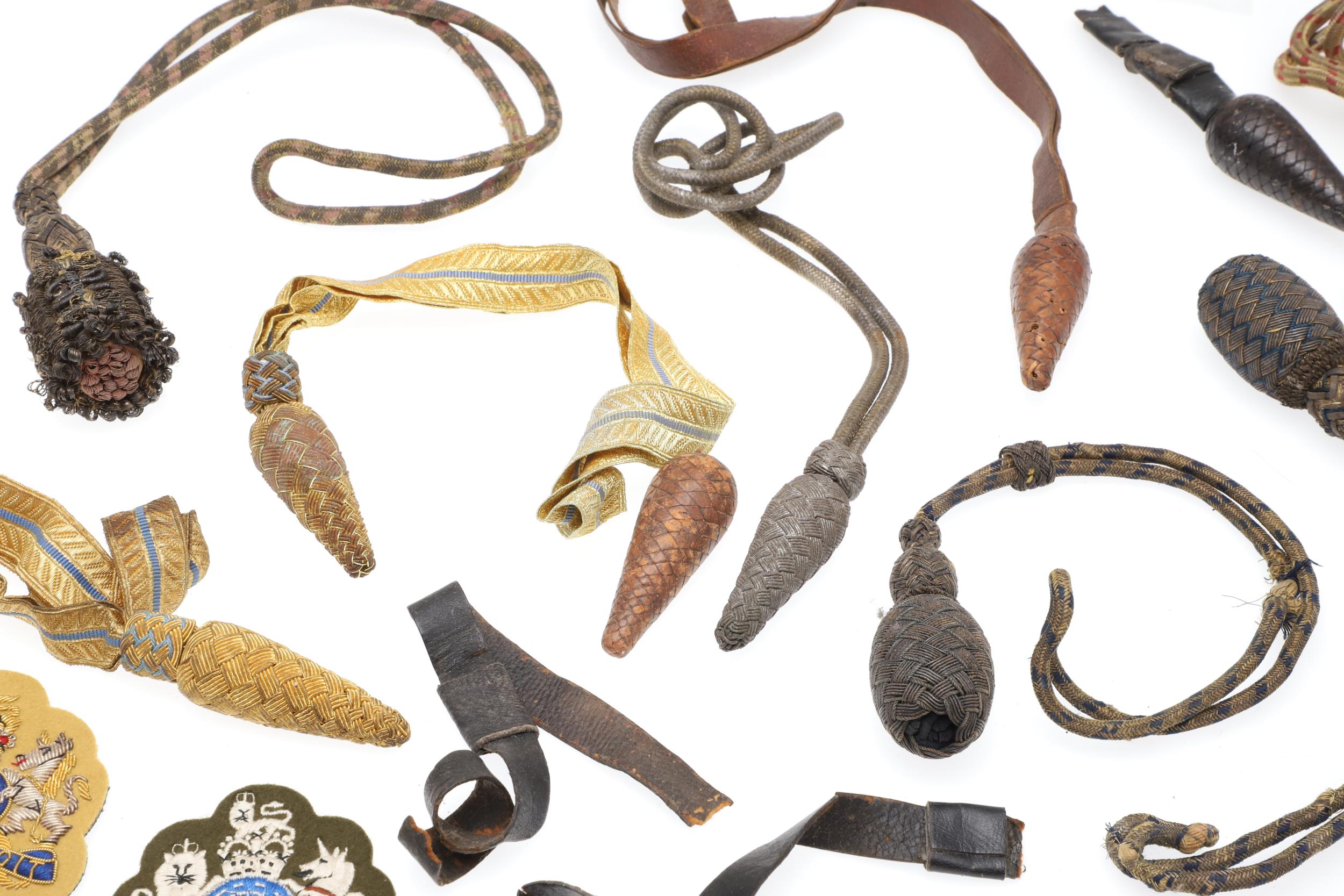 A COLLECTION OF SWORD KNOTS AND MILITARY BADGES. - Image 7 of 11