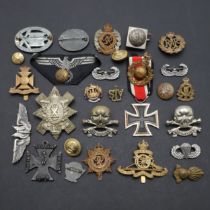 A COLLECTION OF SECOND WORLD WAR GERMAN AND BRITISH BADGES TO INCLUDE A WOUND BADGE.