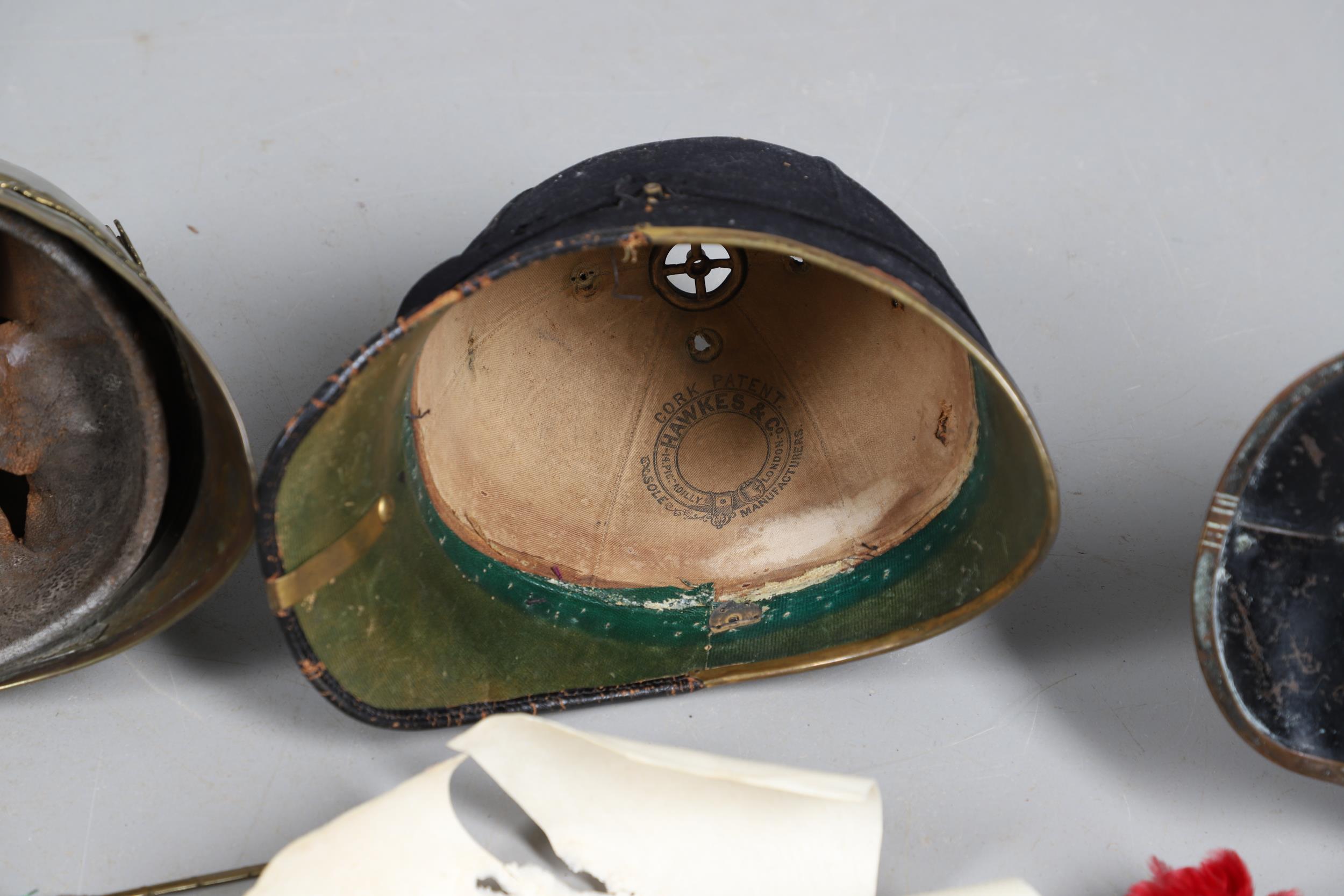 A COLLECTION OF VICTORIAN AND LATER HELMETS AND PARTS TO INCLUDE 1871 PATTERN SHELLS. - Bild 17 aus 19