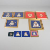 A COLLECTION OF FRAMED NEEDLEWORK MILITARY AND ROYAL CRESTS.