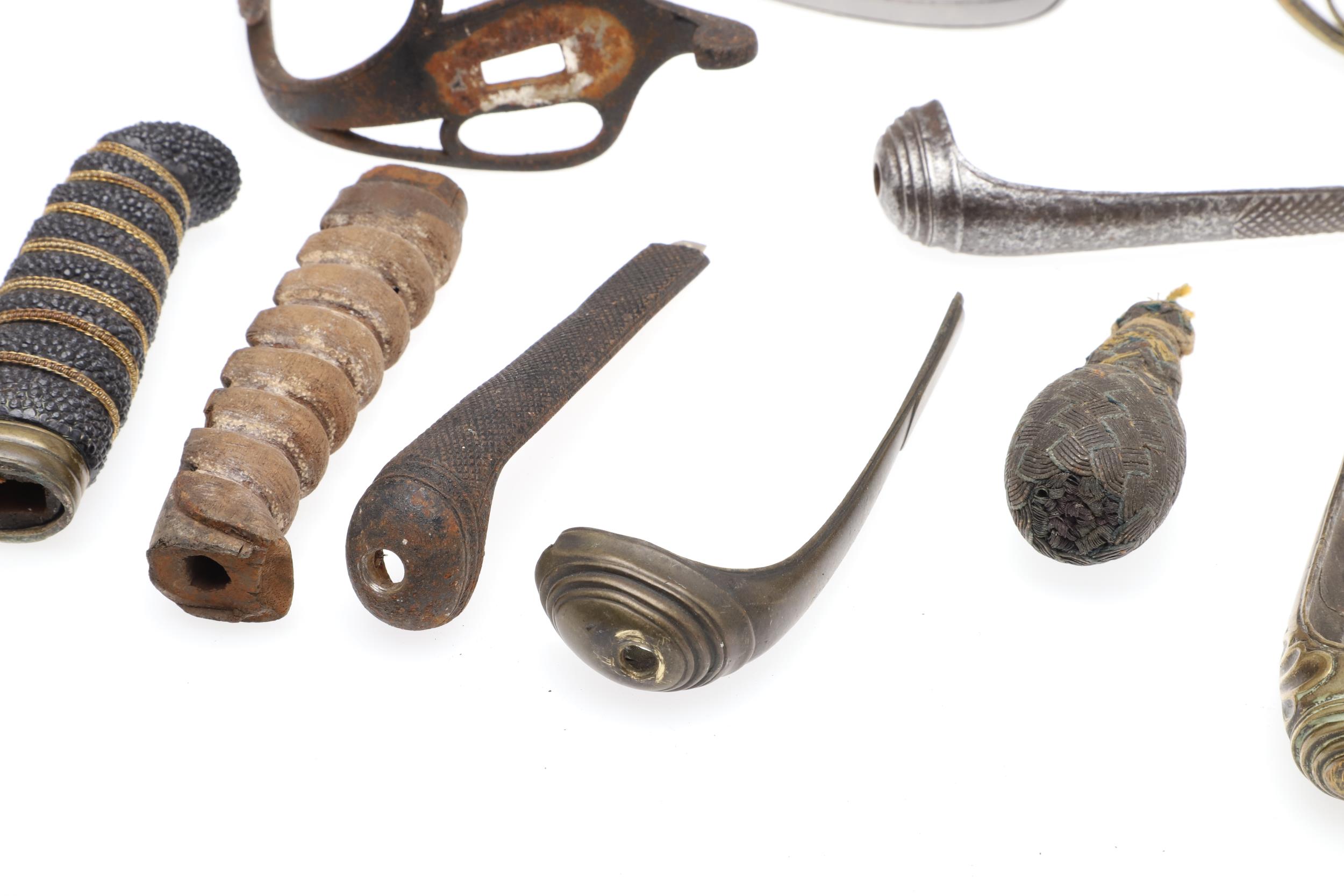A COLLECTION OF SWORD FITTINGS TO INCLUDE GRIPS, GUARDS AND OTHERS. - Image 12 of 12